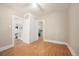 Spacious bedroom with hardwood floors, a ceiling fan, and a closet for storage at 2345 S Williams St, Denver, CO 80210