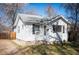 Charming single-story home featuring a well-maintained front yard and white siding at 2345 S Williams St, Denver, CO 80210