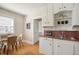 Charming kitchen with vintage cabinets, a dining nook, and natural lighting at 2345 S Williams St, Denver, CO 80210