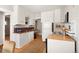 Functional kitchen featuring white cabinets, a gas range, and a light wood countertop at 2345 S Williams St, Denver, CO 80210