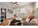 Bright living room featuring hardwood floors, stylish décor, and ample natural light at 2345 S Williams St, Denver, CO 80210