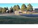 Outdoor basketball court and tennis court in a well-maintained community park setting at 17968 E Colgate Pl, Aurora, CO 80013