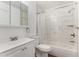 Updated bathroom with a new tiled shower, modern fixtures, and vanity with storage at 17968 E Colgate Pl, Aurora, CO 80013