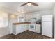 Bright kitchen featuring updated appliances, wood look countertops, and ample cabinet space at 17968 E Colgate Pl, Aurora, CO 80013