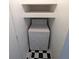 Laundry area features a dryer and checkered tile flooring at 17968 E Colgate Pl, Aurora, CO 80013