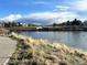 Scenic view of a community pond with walking path at 17968 E Colgate Pl, Aurora, CO 80013