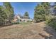Spacious backyard with lawn, mature trees, and patio area, providing outdoor enjoyment at 1376 S Laredo Ct, Aurora, CO 80017