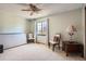 Bright bedroom featuring neutral walls, carpet, and a ceiling fan for added comfort at 1376 S Laredo Ct, Aurora, CO 80017