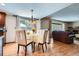 Bright dining area with hardwood floors open to the living room space at 1376 S Laredo Ct, Aurora, CO 80017