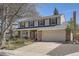 Charming two-story home features a covered front porch and attached two-car garage at 1376 S Laredo Ct, Aurora, CO 80017