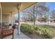 Cozy front porch view, complete with seating, potted plants, and street views at 1376 S Laredo Ct, Aurora, CO 80017