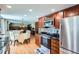 Modern kitchen with granite countertops and an open view of the dining area at 1376 S Laredo Ct, Aurora, CO 80017
