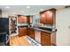 Spacious kitchen featuring granite countertops, stainless steel appliances, and hardwood floors at 1376 S Laredo Ct, Aurora, CO 80017