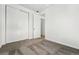Bedroom featuring neutral carpet, closet and doorway at 8816 Whiteclover St, Littleton, CO 80125