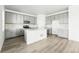 Stylish kitchen with gray cabinets, white countertops, and stainless steel appliances at 8816 Whiteclover St, Littleton, CO 80125