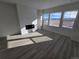 Bright living room boasts a fireplace, large windows, and scenic views at 8816 Whiteclover St, Littleton, CO 80125