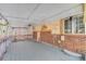 Covered back porch with ceiling fan and brick exterior at 14657 E Oregon Dr, Aurora, CO 80012