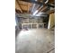 Unfinished basement area with work tables and exposed ceiling, ready to be customized at 21580 Longs Peak Ln, Parker, CO 80138
