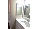 Well-lit bathroom featuring a marble countertop and modern fixtures at 21580 Longs Peak Ln, Parker, CO 80138