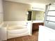 Bathroom featuring a soaking tub, double sink vanity, and neutral paint at 21580 Longs Peak Ln, Parker, CO 80138
