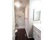 Renovated bathroom showcasing a walk-in shower, marble tile, and vanity with countertop at 21580 Longs Peak Ln, Parker, CO 80138