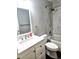 Well-maintained bathroom featuring marble countertops, a shower-tub combo, and vanity with storage at 21580 Longs Peak Ln, Parker, CO 80138