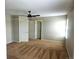 Spacious bedroom featuring neutral walls and ceiling fan, enhanced with double doors at 21580 Longs Peak Ln, Parker, CO 80138