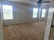 Spacious bedroom with neutral walls and multiple windows for natural light, plus ceiling fan at 21580 Longs Peak Ln, Parker, CO 80138
