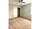 Cozy bedroom with carpet, a ceiling fan, neutral paint, and a window with blinds at 21580 Longs Peak Ln, Parker, CO 80138