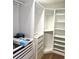 Custom closet features drawers and adjustable shelving to maximize storage space at 21580 Longs Peak Ln, Parker, CO 80138