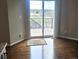 A light-filled dining area features hardwood floors and access to a deck with picturesque views at 21580 Longs Peak Ln, Parker, CO 80138