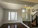 Bright foyer featuring wood flooring, large windows, and grand chandelier at 21580 Longs Peak Ln, Parker, CO 80138