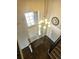 Bright entryway featuring wood floors, a staircase, and a modern chandelier at 21580 Longs Peak Ln, Parker, CO 80138