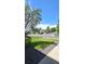 Well maintained front yard with mature trees and green lawn at 21580 Longs Peak Ln, Parker, CO 80138