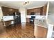 Well-appointed kitchen with granite countertops, stainless steel appliances, and dark wood cabinets at 21580 Longs Peak Ln, Parker, CO 80138