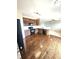 Open-concept kitchen featuring modern appliances and sleek dark wood floors at 21580 Longs Peak Ln, Parker, CO 80138