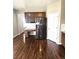 A spacious kitchen offers stainless steel appliances, dark wood cabinets and desk space at 21580 Longs Peak Ln, Parker, CO 80138