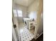 Functional laundry room equipped with a washer, dryer, utility sink, and ample storage space at 21580 Longs Peak Ln, Parker, CO 80138