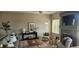 Inviting living room with fireplace, stylish decor, neutral tones, and lots of natural light at 21580 Longs Peak Ln, Parker, CO 80138