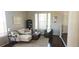 Cozy living room featuring neutral tones, stylish furniture, and hardwood floors at 21580 Longs Peak Ln, Parker, CO 80138