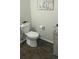 Toilet room with a toilet and adjacent vanity offering a compact space with minimal decor at 21580 Longs Peak Ln, Parker, CO 80138
