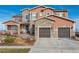 Inviting two-story home featuring a stone facade and a convenient two-car garage at 22435 Boundstone Dr, Parker, CO 80138