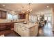 Open kitchen with granite island and view to dining and living space at 22435 Boundstone Dr, Parker, CO 80138