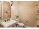Cozy powder room features a pedestal sink, classic fixtures, and decorative wall art at 22435 Boundstone Dr, Parker, CO 80138