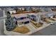 A view of two homes in the suburbs featuring tiled roofs, and ample parking space in the driveways at 4539 Lyndenwood Cir, Highlands Ranch, CO 80130