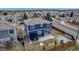 A fenced backyard with a patio, small trampoline, and well-maintained lawn at 4539 Lyndenwood Cir, Highlands Ranch, CO 80130