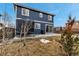 A spacious backyard showcasing a trampoline, concrete patio, and well-maintained lawn at 4539 Lyndenwood Cir, Highlands Ranch, CO 80130
