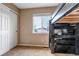 Bedroom featuring a bunkbed, large window with natural light, and closet at 4539 Lyndenwood Cir, Highlands Ranch, CO 80130