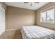 Bright bedroom featuring a large window and neutral walls at 4539 Lyndenwood Cir, Highlands Ranch, CO 80130