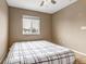 Cozy bedroom with a large window offering ample natural light at 4539 Lyndenwood Cir, Highlands Ranch, CO 80130